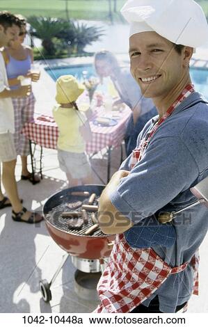 people, cooking, outdoors, family, cook, barbecue View Large Photo Image Stock Image - people, cooking, outdoors, family, cook, barbecue. Fotosearch