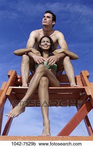 people, couple, beach, chairs, young adult, Young couples beach sitting View Large Photo Image Stock Image - people, couple, beach, chairs, young adult, Young couples beach sitting. Fotosearch