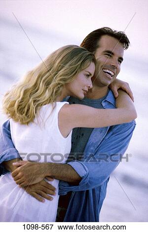 people, couple, beach, laughing, lifestyles, hugging, serious View Large Photo Image Stock Photo - people, couple, beach, laughing, lifestyles, hugging, serious. Fotosearch