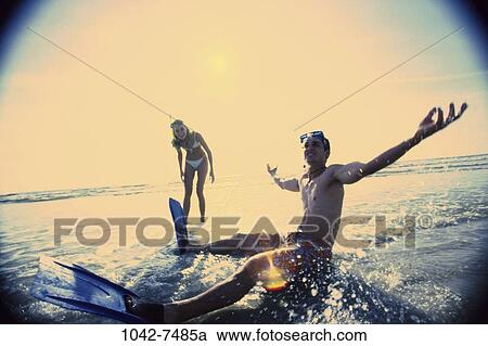 people, couple, beach, outdoors, adventurous, goggles, vacation View Large Photo Image Stock Image - people, couple, beach, outdoors, adventurous, goggles, vacation. Fotosearch