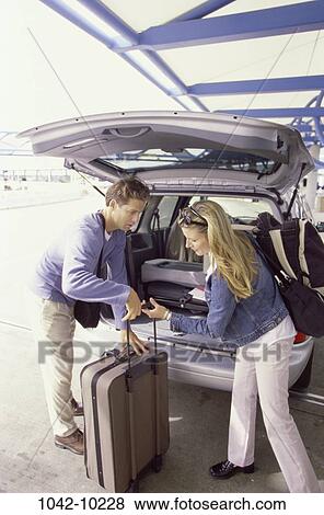 people, couple, car, luggage, outdoors, vacation, unloading View Large Photo Image Stock Photo - people, couple, car, luggage, outdoors, vacation, unloading. Fotosearch