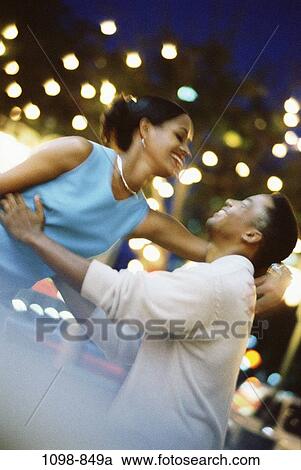 people, couple, catching, dancing, motion, outdoors, joyous View Large Photo Image Stock Image - people, couple, catching, dancing, motion, outdoors, joyous. Fotosearch