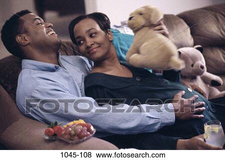 people, couple, fruit, couch, relaxing, commitment, planning View Large Photo Image Stock Photo - people, couple, fruit, couch, relaxing, commitment, planning. Fotosearch