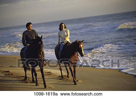 people, couple, Hispanic, beach, riding, sports View Large Photo Image Stock Image - people, couple, Hispanic, beach, riding, sports. Fotosearch
