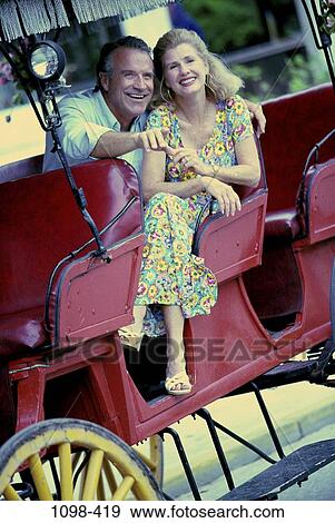 people, couple, pointing, outdoors, Middle-aged, friends, tourists View Large Photo Image Stock Photo - people, couple, pointing, outdoors, Middle-aged, friends, tourists. Fotosearch