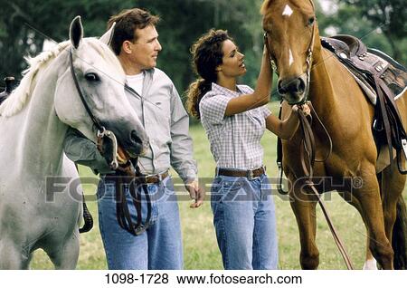 people, couple, ranch, pets, pet, holding View Large Photo Image Stock Photo - people, couple, ranch, pets, pet, holding. Fotosearch