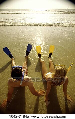 people, couple, sunset, beach, outdoors, tide, tranquility View Large Photo Image Stock Image - people, couple, sunset, beach, outdoors, tide, tranquility. Fotosearch