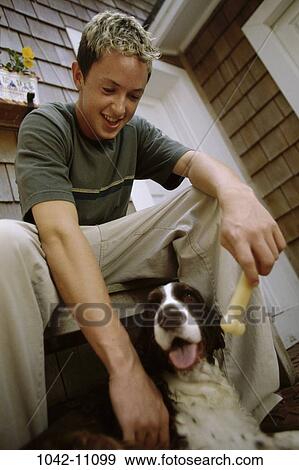 people, dog, male, sitting, pet, outdoors, blond View Large Photo Image Stock Photo - people, dog, male, sitting, pet, outdoors, blond. Fotosearch