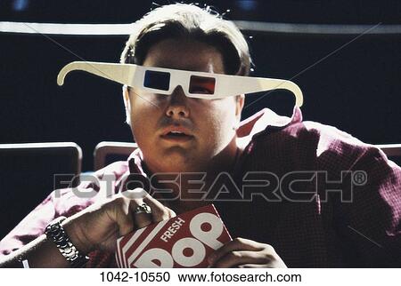 people, eating, male, eyeglasses, popcorn, watch View Large Photo Image Stock Image - people, eating, male, eyeglasses, popcorn, watch. Fotosearch