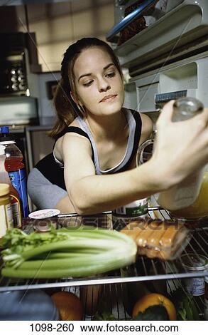 people, eating, woman, refrigerator, holding, looking, contemplation View Large Photo Image Stock Image - people, eating, woman, refrigerator, holding, looking, contemplation. Fotosearch
