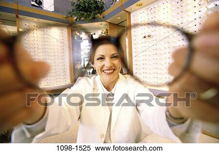 people, eye, woman, magnifying, eyeglasses, testing, doctor View Large Photo Image Stock Photography - people, eye, woman, magnifying, eyeglasses, testing, doctor. Fotosearch