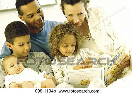 Stock Image - people, family, parents, indoors, Families indoors various. Fotosearch
