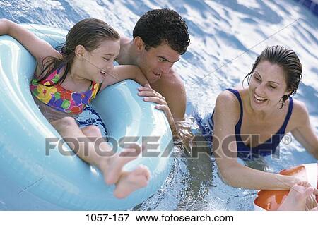 people, floating, pool, playing, outdoors, family View Large Photo Image Stock Photo - people, floating, pool, playing, outdoors, family. Fotosearch