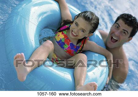 people, floating, water, smiling, Hispanic, inner tube View Large Photo Image Stock Image - people, floating, water, smiling, Hispanic, inner tube. Fotosearch