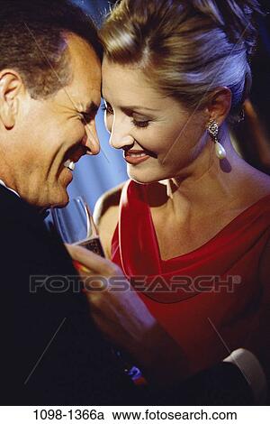 people, formal, smiling, couple, champagne, laughing, flirting View Large Photo Image Stock Image - people, formal, smiling, couple, champagne, laughing, flirting. Fotosearch