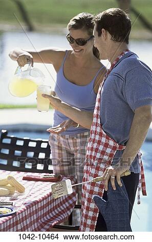 people, glass, smiling, couple, picnic, pouring, drinking View Large Photo Image Picture - people, glass, smiling, couple, picnic, pouring, drinking. Fotosearch