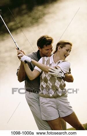 people, golf, couple, swing, outdoors, sports, Middle-aged View Large Photo Image Stock Image - people, golf, couple, swing, outdoors, sports, Middle-aged. Fotosearch