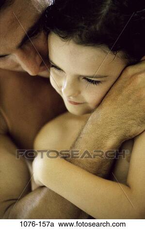 Stock Image - people, Hispanic, nurturing, hugging, family, affection, comforting. Fotosearch