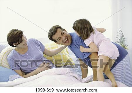 people, home, bed, happy, laughing, family View Large Photo Image Stock Photo - people, home, bed, happy, laughing, family. Fotosearch