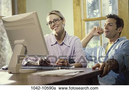people, home, couple, eyeglasses, computer, Middle-aged View Large Photo Image Stock Image - people, home, couple, eyeglasses, computer, Middle-aged. Fotosearch