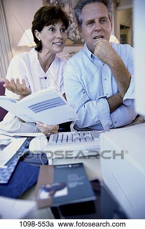 people, home, couple, technology, computer, reading, consulting View Large Photo Image Stock Image - people, home, couple, technology, computer, reading, consulting. Fotosearch