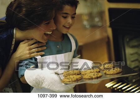 Stock Photo - people, home, mother, family, admiring. Fotosearch