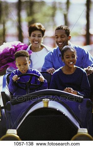 people, laughing, outdoors, amusement, family, steering, ride View Large Photo Image Stock Photo - people, laughing, outdoors, amusement, family, steering, ride. Fotosearch