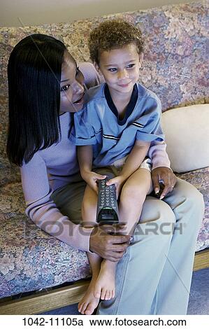 people, monitor, sitting, mother, watch, couch, entertainment View Large Photo Image Stock Image - people, monitor, sitting, mother, watch, couch, entertainment. Fotosearch