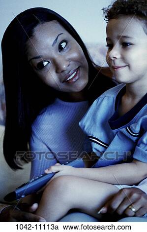 people, monitor, sitting, mother, watch, entertainment, view View Large Photo Image Stock Image - people, monitor, sitting, mother, watch, entertainment, view. Fotosearch