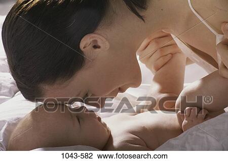 people, mother, baby, family, affection, touching View Large Photo Image Stock Image - people, mother, baby, family, affection, touching. Fotosearch