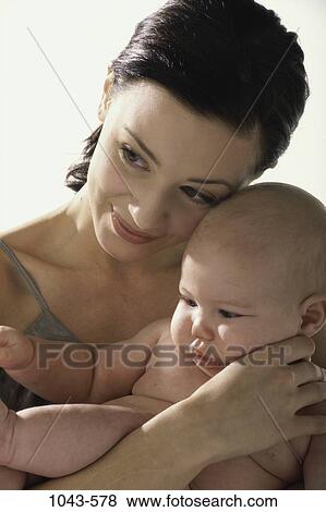 Stock Photo - people, mother, baby, holding, family, close, cuddling. Fotosearch