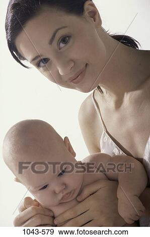 people, mother, baby, holding, family, infant View Large Photo Image Stock Photo - people, mother, baby, holding, family, infant. Fotosearch