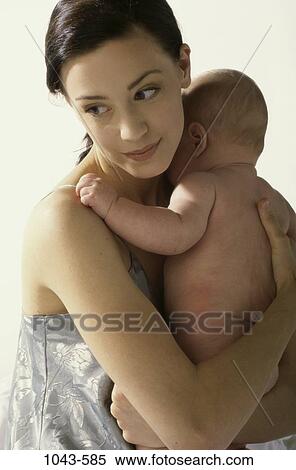 people, mother, baby, holding, nurturing, family, comforting View Large Photo Image Stock Photography - people, mother, baby, holding, nurturing, family, comforting. Fotosearch