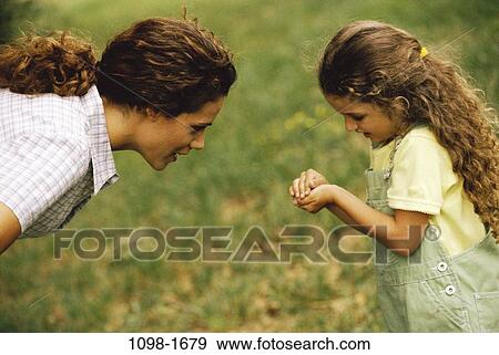 people, mother, curious, showing, daughter, sharing, discovery View Large Photo Image Stock Photo - people, mother, curious, showing, daughter, sharing, discovery. Fotosearch