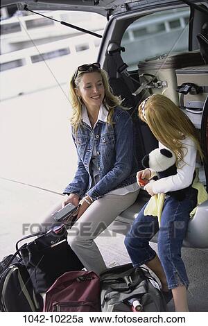 people, mother, luggage, outdoors, vacations, outings, family View Large Photo Image Stock Image - people, mother, luggage, outdoors, vacations, outings, family. Fotosearch