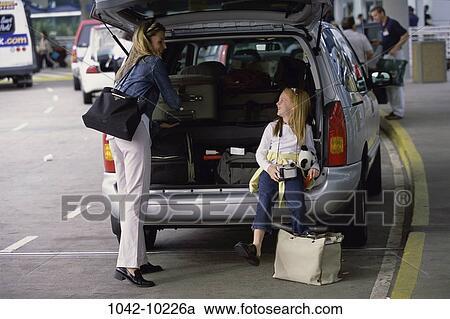 people, mother, luggage, outdoors, vacations, outings, family View Large Photo Image Stock Image - people, mother, luggage, outdoors, vacations, outings, family. Fotosearch