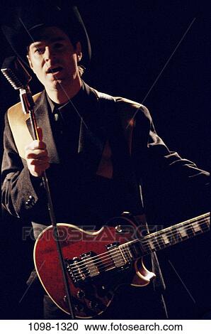 Stock Image - people, music, guitar, entertainment, singing. Fotosearch