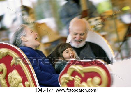 people, outdoors, amusement park, grandparents, grandchild, granddaughter, rides View Large Photo Image Stock Photo - people, outdoors, amusement park, grandparents, grandchild, granddaughter, rides. Fotosearch