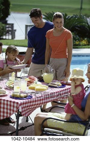 Picture - people, picnic, summer, outdoors, family, food. Fotosearch