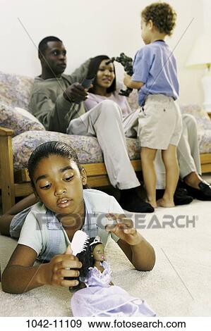 people, playing, listening, watch, couch, relaxing, watching View Large Photo Image Stock Photo - people, playing, listening, watch, couch, relaxing, watching. Fotosearch