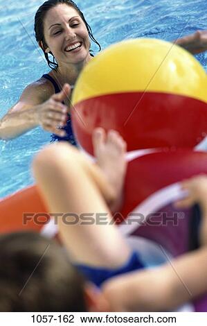 people, playing, mother, Hispanic, leg, outdoors, smile View Large Photo Image Stock Image - people, playing, mother, Hispanic, leg, outdoors, smile. Fotosearch