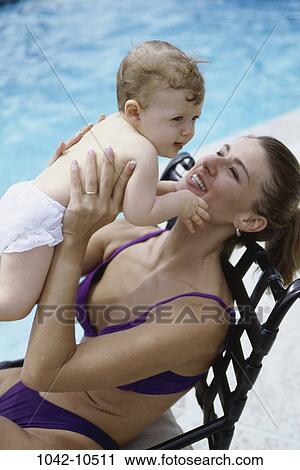 people, pool, mother, baby, outdoors, poolside, family View Large Photo Image Stock Image - people, pool, mother, baby, outdoors, poolside, family. Fotosearch