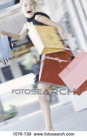 people, running, woman, walking, laughing, outdoors, shopping View Large Photo Image Stock Photo - people, running, woman, walking, laughing, outdoors, shopping. Fotosearch