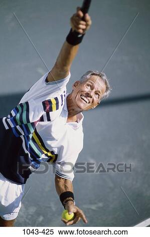 Stock Photography - people, senior, tennis, outdoors, Caucasian, serve. Fotosearch