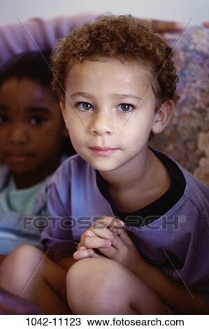 people, sitting, couch, boy, child, brunette, squatting View Large Photo Image Stock Image - people, sitting, couch, boy, child, brunette, squatting. Fotosearch
