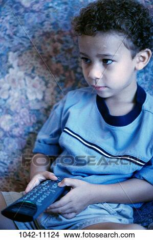 people, sitting, watch, couch, boy, entertainment, watching View Large Photo Image Picture - people, sitting, watch, couch, boy, entertainment, watching. Fotosearch