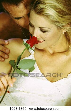 people, smelling, couple, rose, holding, flower, romantic View Large Photo Image Stock Photo - people, smelling, couple, rose, holding, flower, romantic. Fotosearch