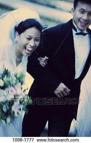 people, smiling, Asian, couple, laughing, flowers, outdoors View Large Photo Image Stock Photo - people, smiling, Asian, couple, laughing, flowers, outdoors. Fotosearch