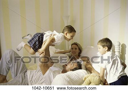 people, smiling, bed, lifting, smile, family View Large Photo Image Stock Image - people, smiling, bed, lifting, smile, family. Fotosearch