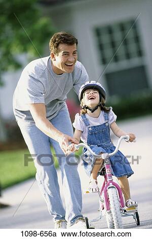 people, smiling, bicycle, laughing, outdoors, nurturing, family View Large Photo Image Stock Image - people, smiling, bicycle, laughing, outdoors, nurturing, family. Fotosearch